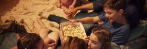 Overhead View Of Family Enjoying Movie Night At Home Together